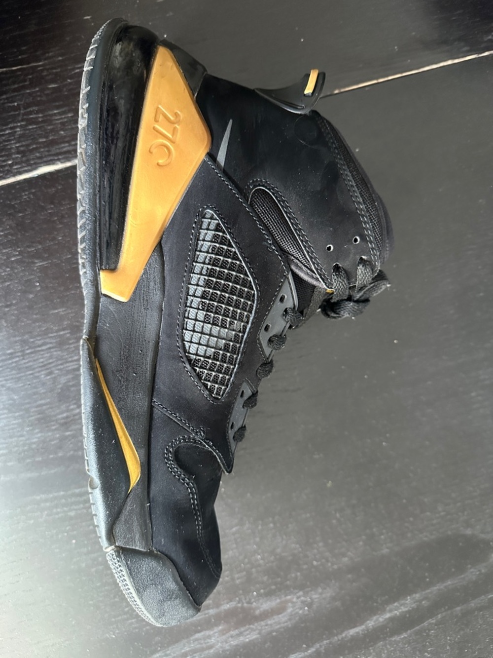 Jordan Black and Gold High-Top Sneakers